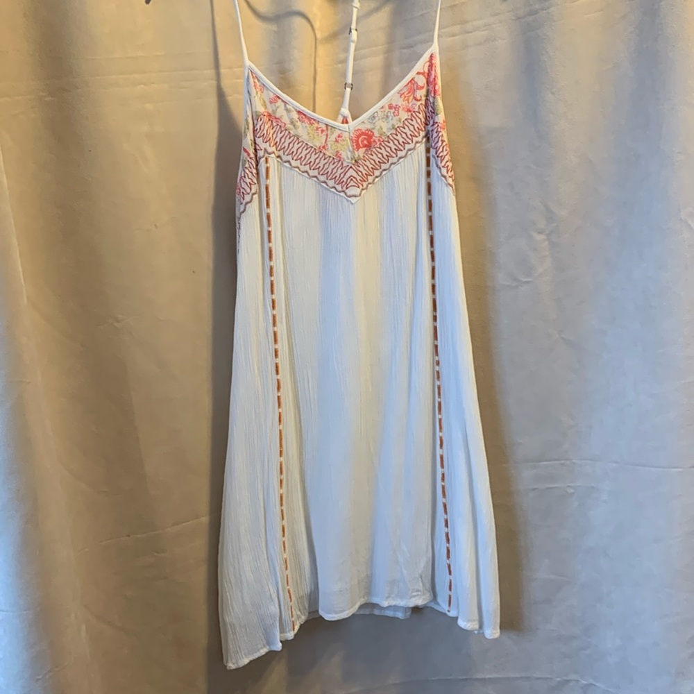 Cream colored, mini dress T-back design